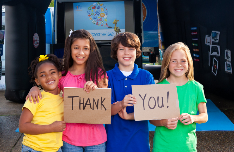Article Hero Kids holding thank you sign 8640 x 2760