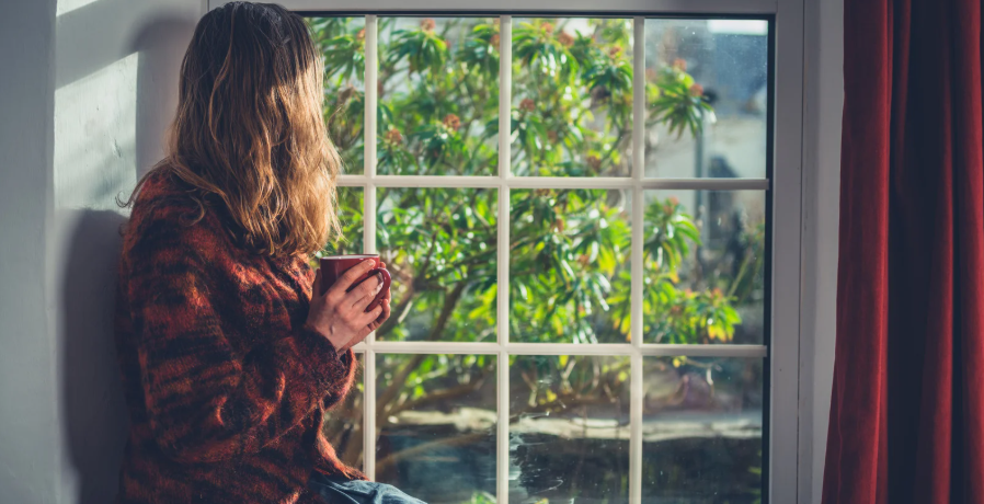 Having tea by window